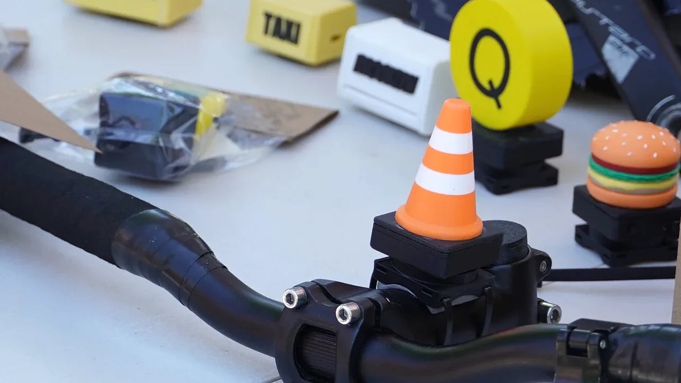 Bike Buddy Cone mounted on a bicycle handlebar with STEMMA accessories