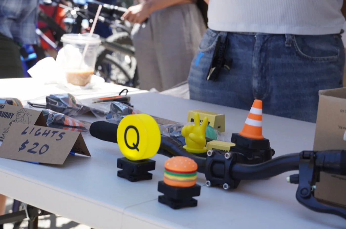 Bike Buddy prototypes mounted on a bicycle handlebar at an outdoor market