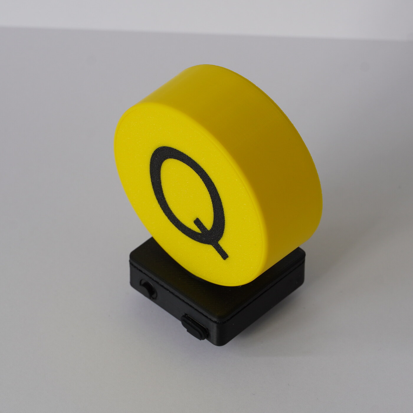 Yellow Signal Glow Bike Buddy prototype centered on a clean tabletop